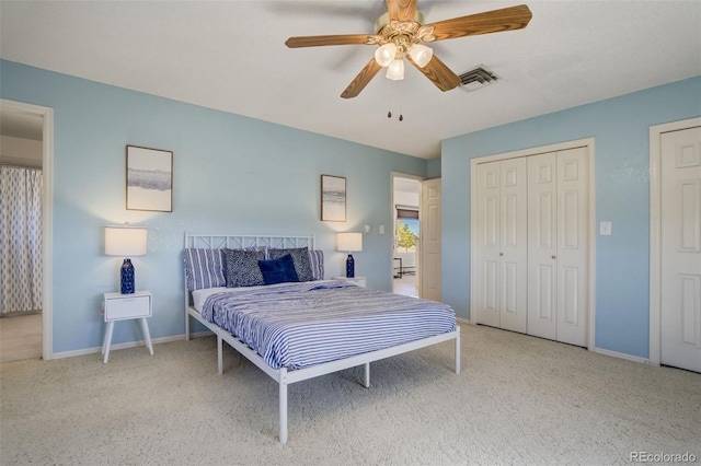 bedroom with ceiling fan, carpet floors, visible vents, and baseboards