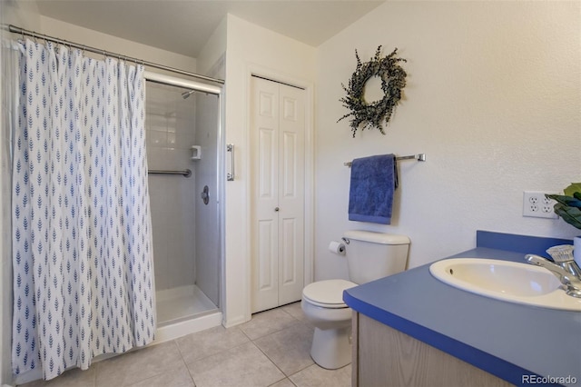 full bath with a closet, a shower stall, toilet, and tile patterned floors