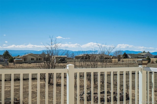 view of mountain feature with a rural view