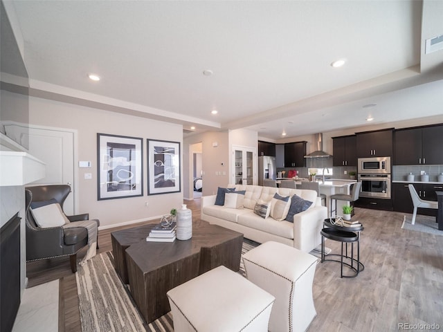 living room with light hardwood / wood-style flooring