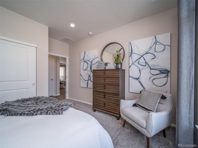 bedroom featuring a closet and carpet flooring