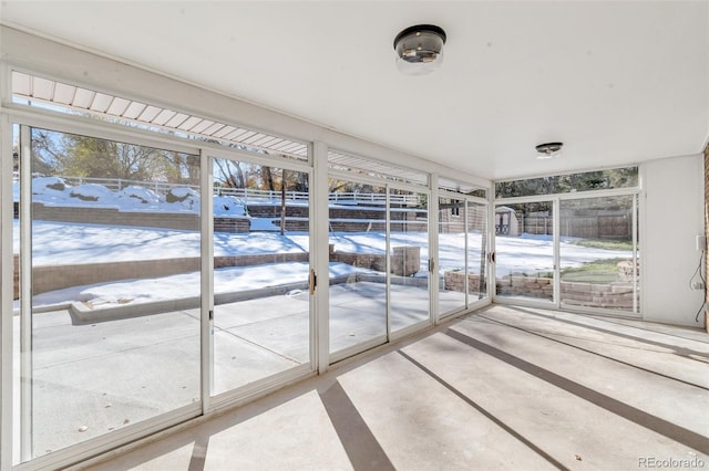 unfurnished sunroom with plenty of natural light