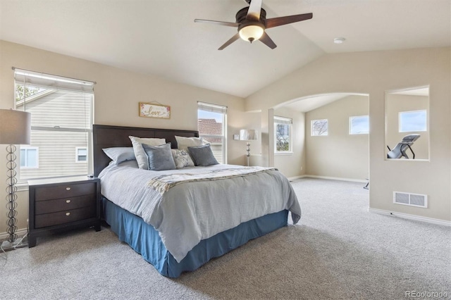 bedroom with baseboards, light carpet, vaulted ceiling, and visible vents