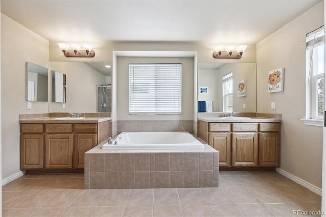 bathroom with plenty of natural light, a sink, and tile patterned flooring