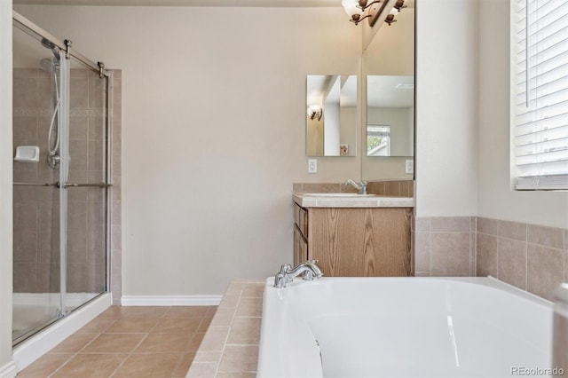 full bathroom with vanity, a bath, tile patterned flooring, and a stall shower