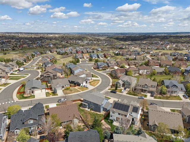 birds eye view of property with a residential view