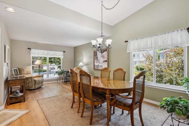 2169 Fox Fire St, Highlands Ranch, CO 80129 - dining room with light wood finished floors, a chandelier, recessed lighting, and vaulted ceiling