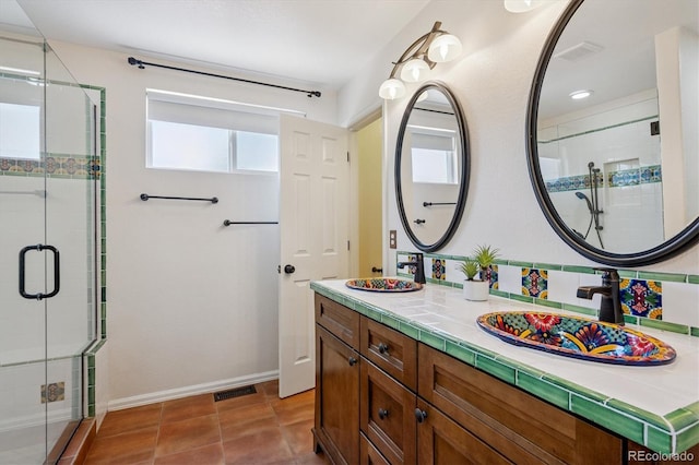 2169 Fox Fire St, Highlands Ranch, CO 80129 - bathroom with a shower stall, vanity, and tile patterned flooring