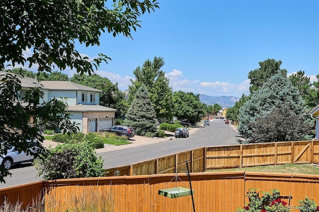 2169 Fox Fire St, Highlands Ranch, CO 80129 - fenced yard with a mountain view and a garage