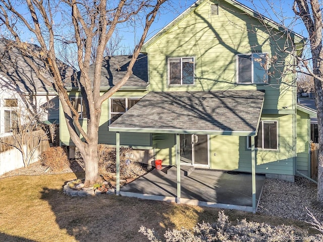 back of house with a patio