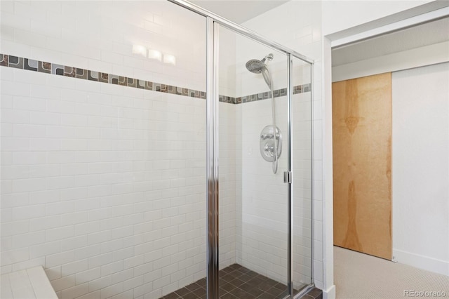 bathroom with a shower with shower door