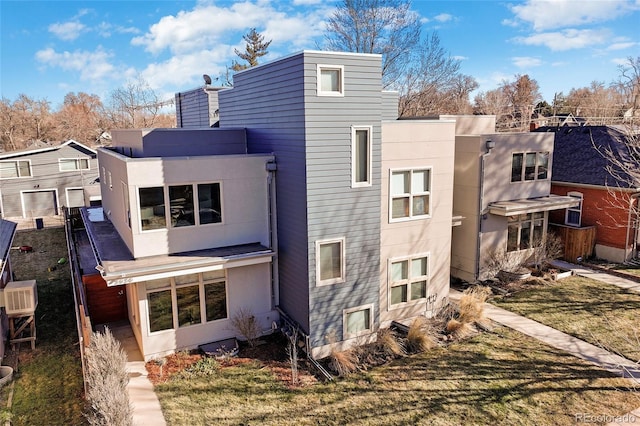 back of house with stucco siding