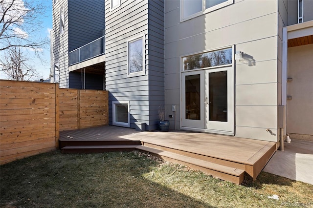 entrance to property featuring a wooden deck