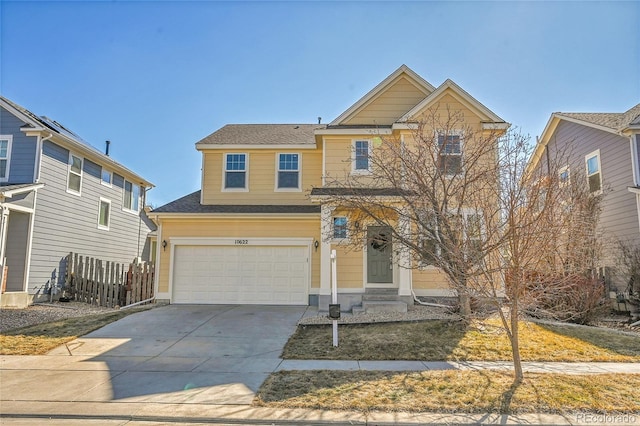 craftsman-style house featuring driveway, an attached garage, and fence