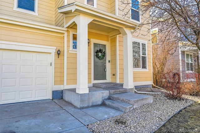 view of exterior entry with a garage