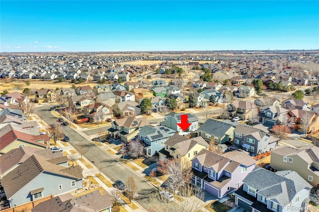 birds eye view of property with a residential view