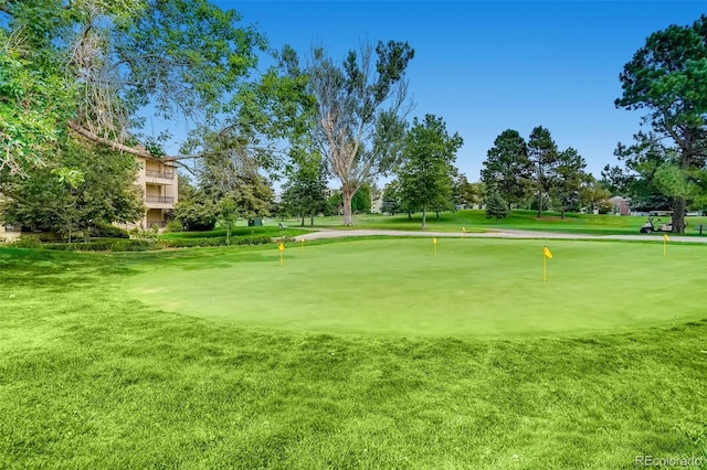 3184 S Heather Gardens Way Unit 302, Aurora, CO 80014 - view of property's community featuring a putting area and a yard