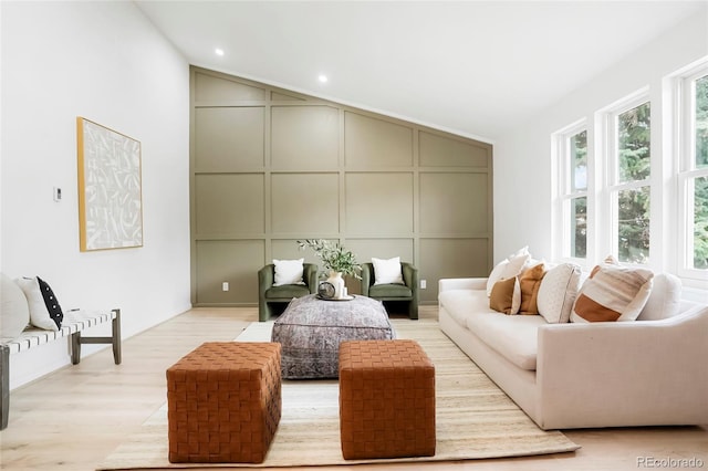 129 Gordon Pl, Castle Rock, CO 80104 - living area featuring recessed lighting, light wood-style floors, vaulted ceiling, and a decorative wall