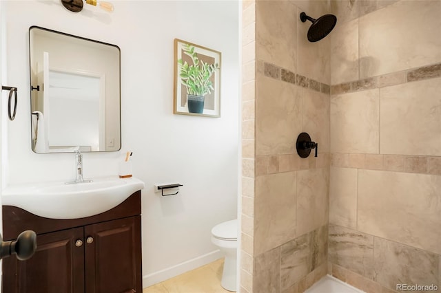 129 Gordon Pl, Castle Rock, CO 80104 - full bathroom with vanity, baseboards, a tile shower, and toilet