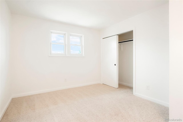 129 Gordon Pl, Castle Rock, CO 80104 - unfurnished bedroom with baseboards, light carpet, and a closet