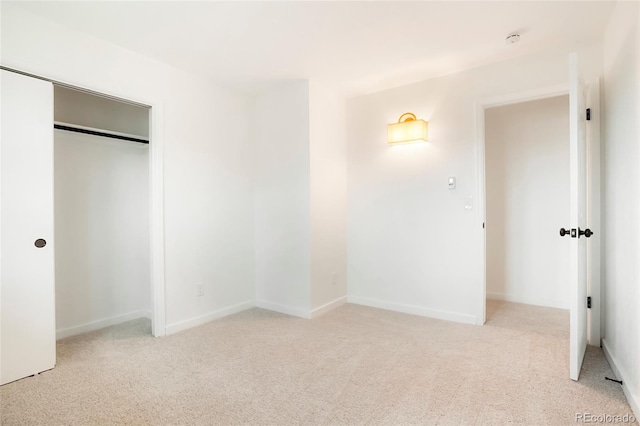 129 Gordon Pl, Castle Rock, CO 80104 - unfurnished bedroom with baseboards, light carpet, and a closet