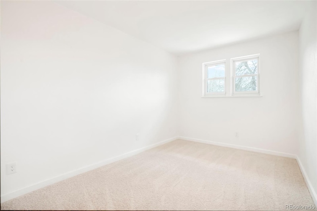 129 Gordon Pl, Castle Rock, CO 80104 - unfurnished room with baseboards and light colored carpet