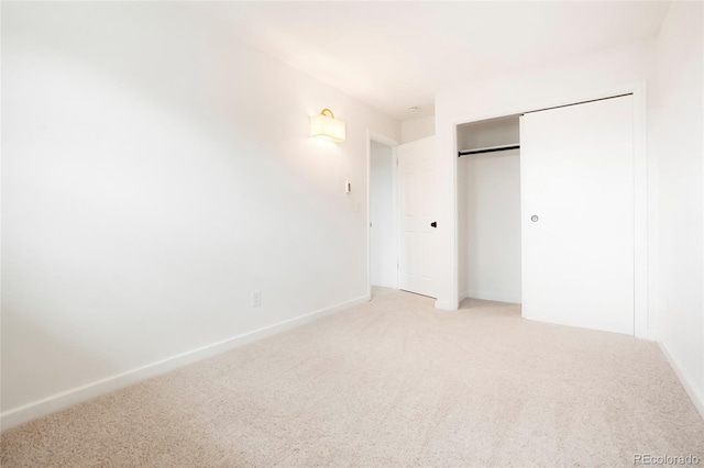 129 Gordon Pl, Castle Rock, CO 80104 - unfurnished bedroom with light colored carpet, baseboards, and a closet