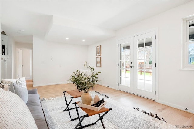 129 Gordon Pl, Castle Rock, CO 80104 - living area featuring french doors, light wood finished floors, and baseboards