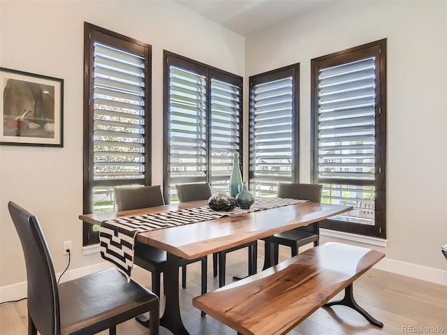 dining area featuring light wood-type flooring