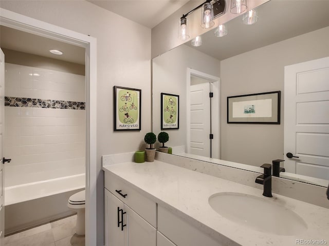 full bathroom with tile patterned flooring, bathing tub / shower combination, vanity, and toilet