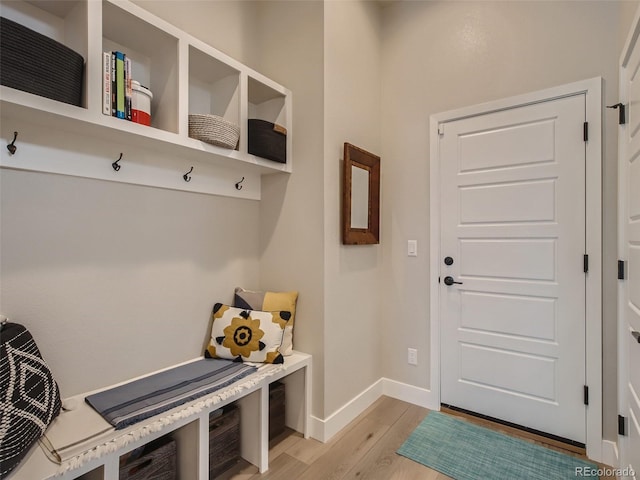 mudroom with light hardwood / wood-style floors