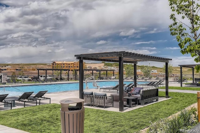 view of swimming pool with a pergola, a patio, and a lawn