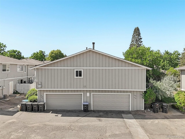 14590 E 13th Ave, Aurora, CO 80011 - view of property exterior with a detached garage and board and batten siding