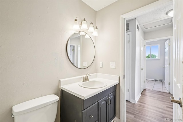 14590 E 13th Ave, Aurora, CO 80011 - bathroom with vanity and wood finished floors