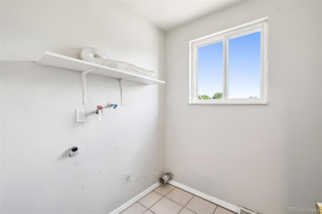14590 E 13th Ave, Aurora, CO 80011 - laundry area with baseboards and light tile patterned floors