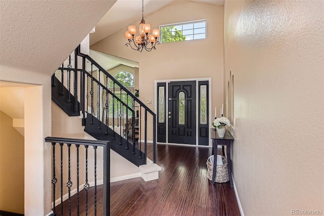 9743 Chanteclair Cir, Highlands Ranch, CO 80126 - entryway with a chandelier, wood finished floors, baseboards, stairs, and vaulted ceiling