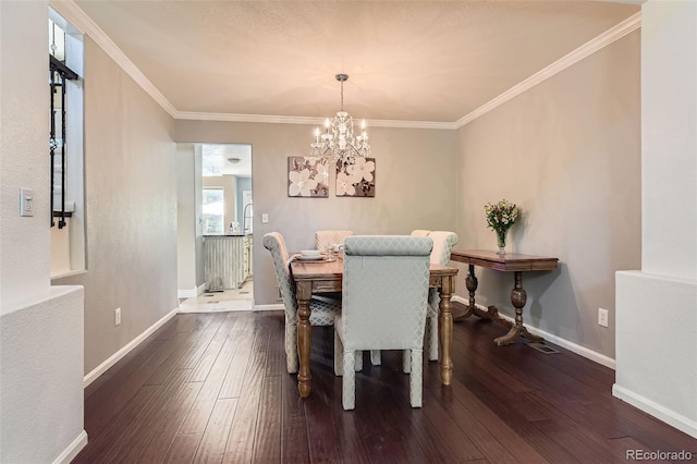 9743 Chanteclair Cir, Highlands Ranch, CO 80126 - dining area with a chandelier, hardwood / wood-style floors, baseboards, and ornamental molding