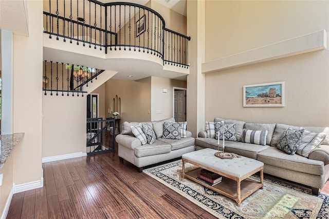 9743 Chanteclair Cir, Highlands Ranch, CO 80126 - living room featuring wood-type flooring, baseboards, a high ceiling, and stairway