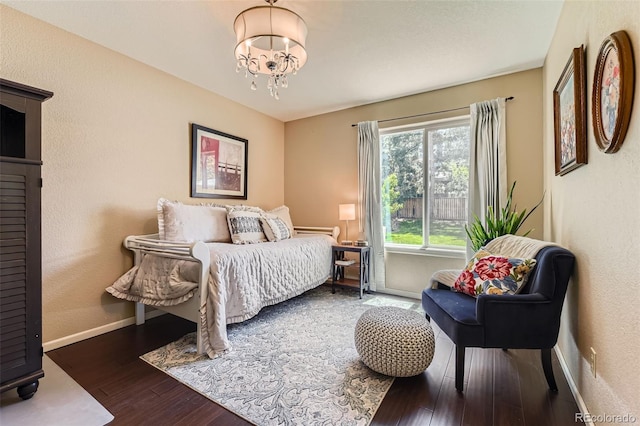 9743 Chanteclair Cir, Highlands Ranch, CO 80126 - bedroom with baseboards, wood finished floors, and a chandelier
