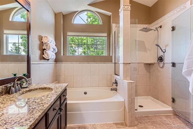9743 Chanteclair Cir, Highlands Ranch, CO 80126 - bathroom with a bath, a shower stall, vanity, and lofted ceiling