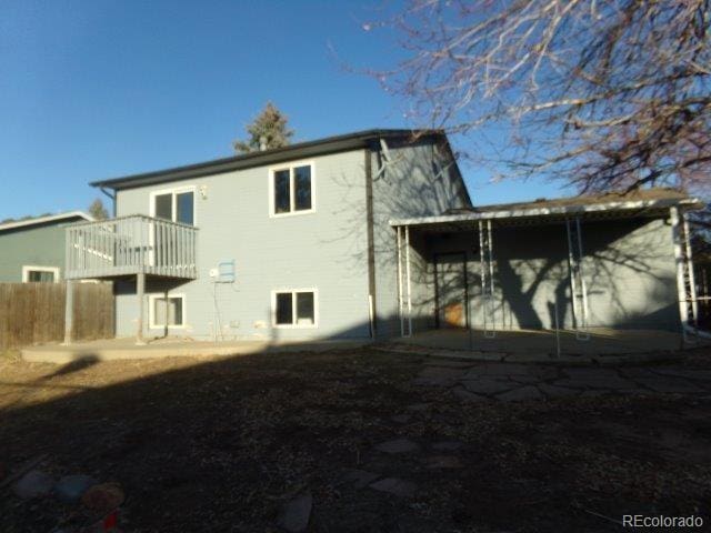 1889 S Flanders Way, Aurora, CO 80017 - rear view of house featuring a balcony