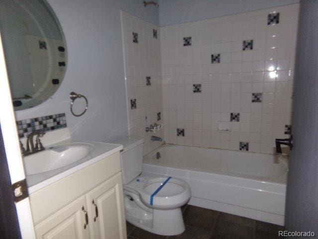 1889 S Flanders Way, Aurora, CO 80017 - full bathroom featuring vanity, shower / bath combination, and tile patterned floors