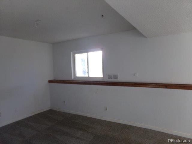 1889 S Flanders Way, Aurora, CO 80017 - unfurnished room featuring dark colored carpet