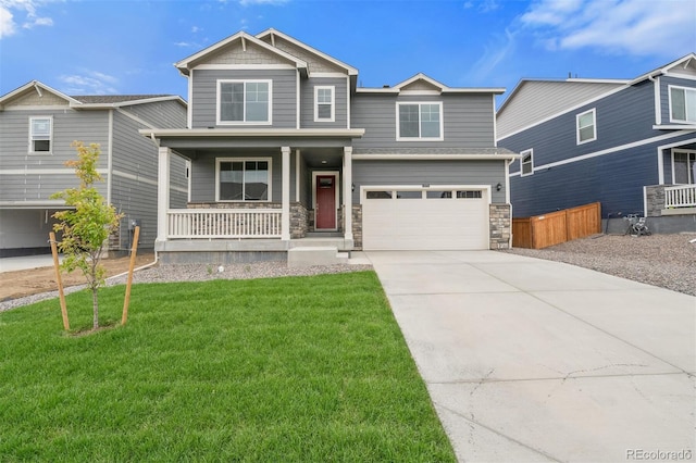 craftsman-style house with a garage, a porch, and a front yard