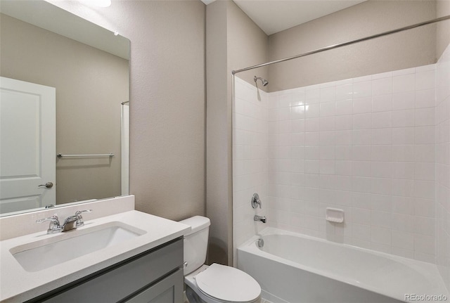 full bathroom with vanity, bathtub / shower combination, and toilet