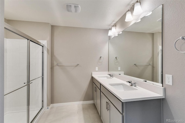 bathroom with vanity and an enclosed shower