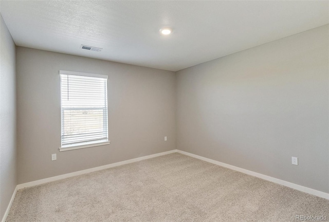 empty room featuring carpet flooring