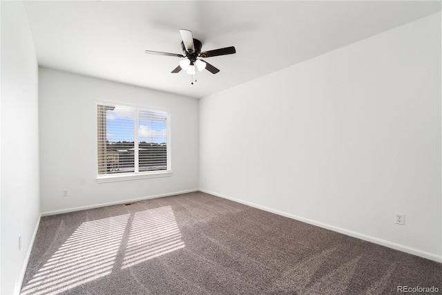 unfurnished room with ceiling fan, carpet, and baseboards