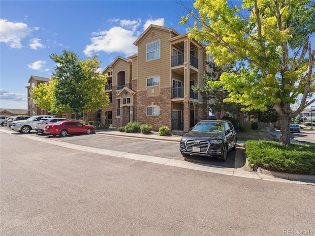 9142 Lodestar Ln Unit 305, Parker, CO 80134 - view of building exterior with uncovered parking