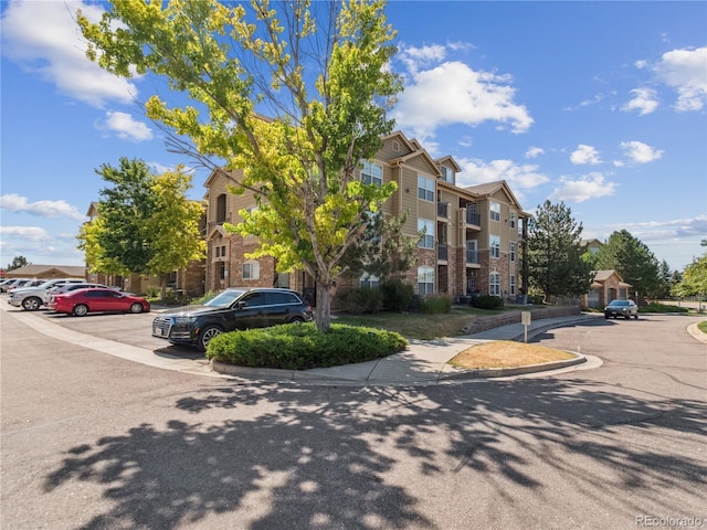 9142 Lodestar Ln Unit 305, Parker, CO 80134 - view of property with uncovered parking
